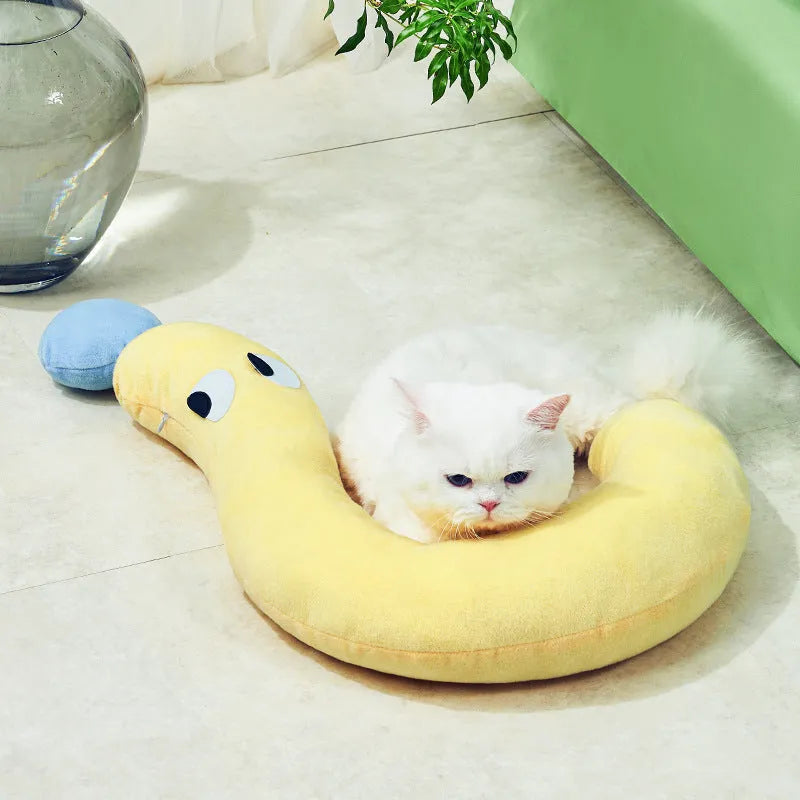 Blue rectangular pet cushion pillow for cats and dogs on a wooden floor.