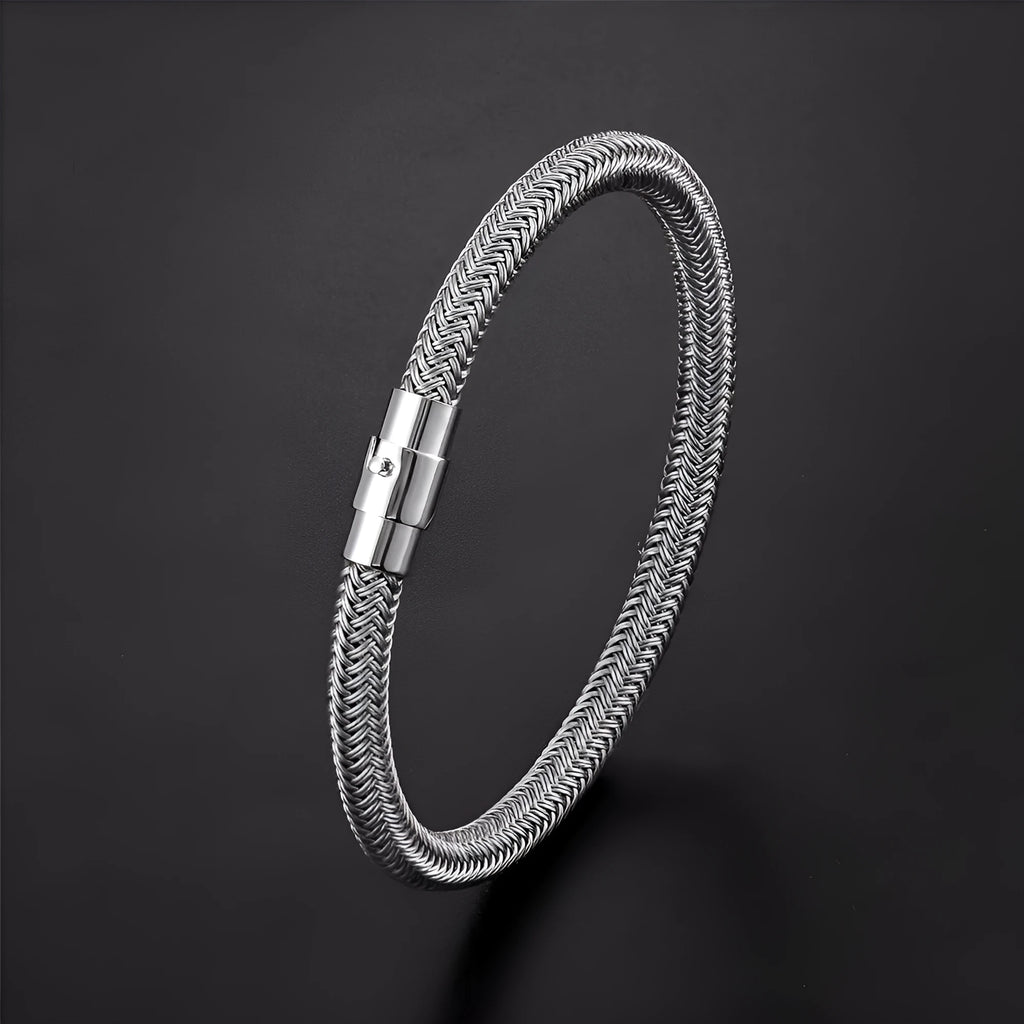 Men's titanium steel geometric bracelet with a magnetic clasp, shown in a silver colour with line pattern details.