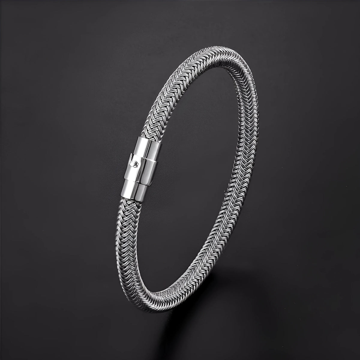 Men's titanium steel geometric bracelet with a magnetic clasp, shown in a silver colour with line pattern details.