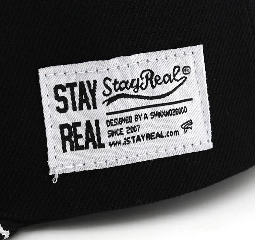 Cotton baseball cap with embroidered letters in black colour showing dome crown shape