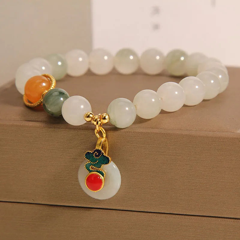 Women's ice jade bracelet with pearl accents and a jade buckle on a retro design.