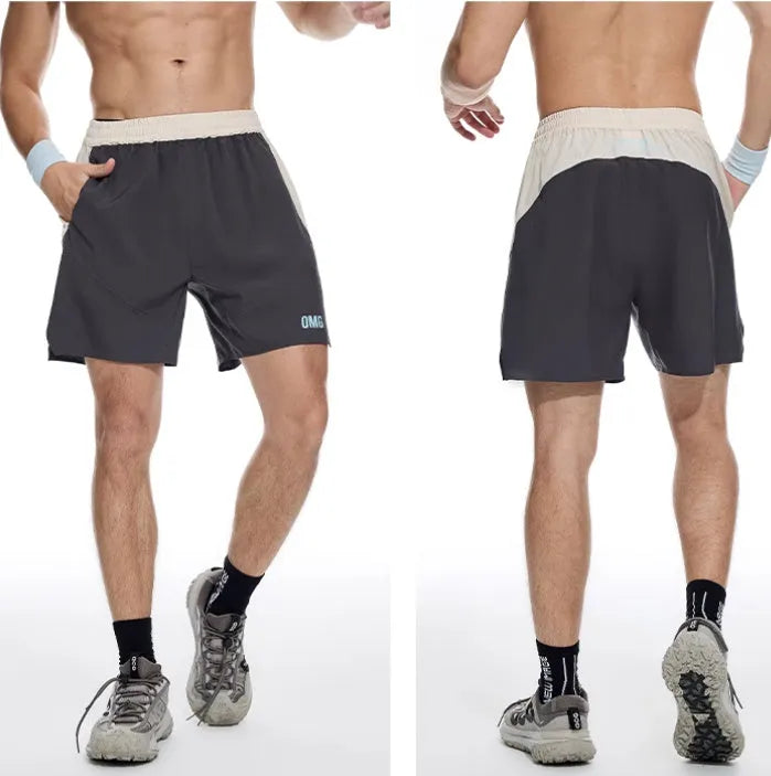 Man's loose grey workout shorts with elastic lace-up waistband, shown from side for gym use.