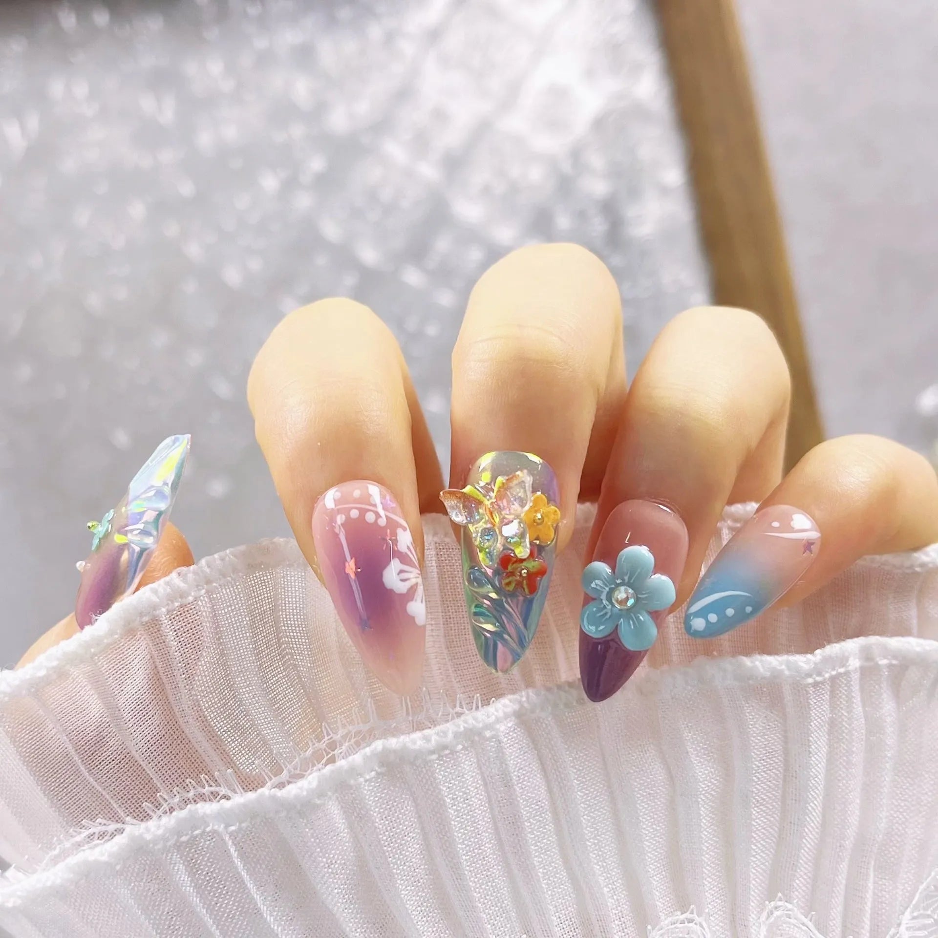 Handmade colourful floral and butterfly nail decorations set with embossed patterns in four sizes