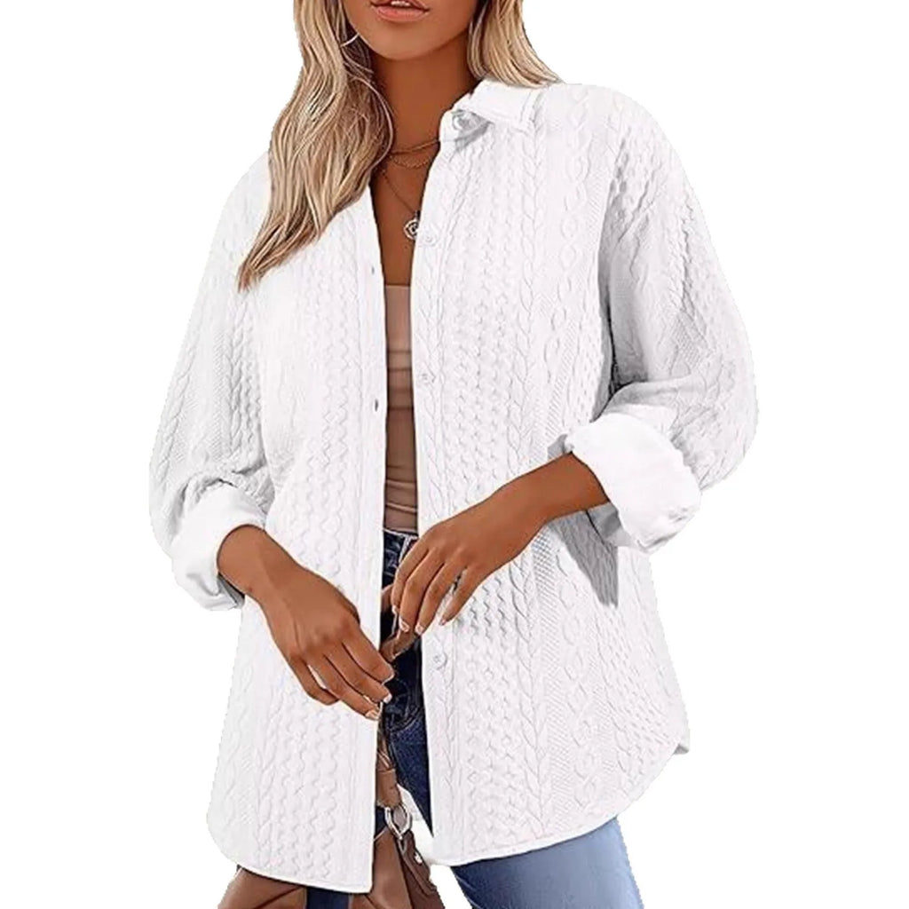 Women's solid colour long-sleeved knitted cardigan in black, shown in a casual setting.