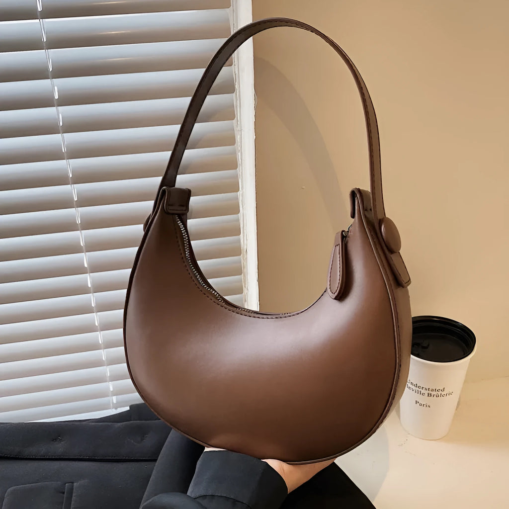 Retro dumpling-shaped women's shoulder bag in PU leather, showing sandwich pocket and cream yellow colour