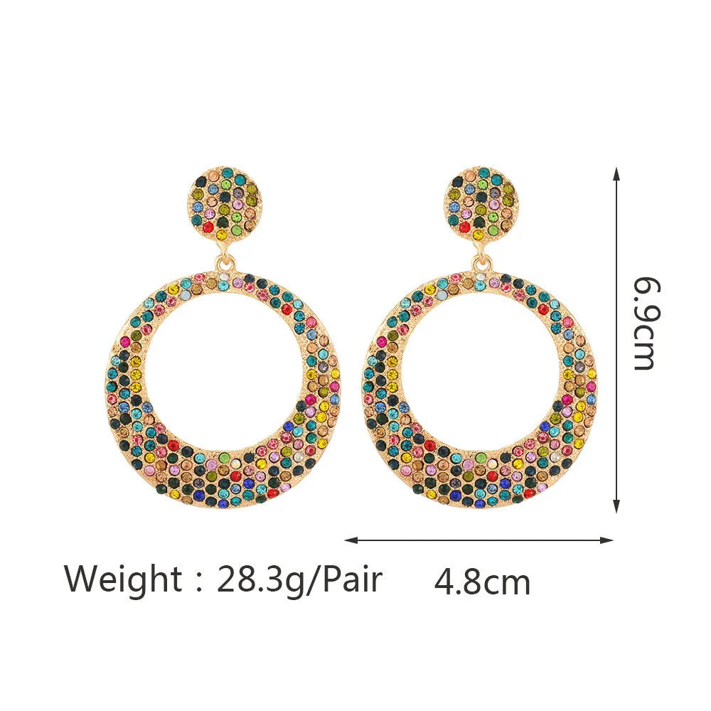 Large round metal alloy pendant earrings with colourful cartoon style design