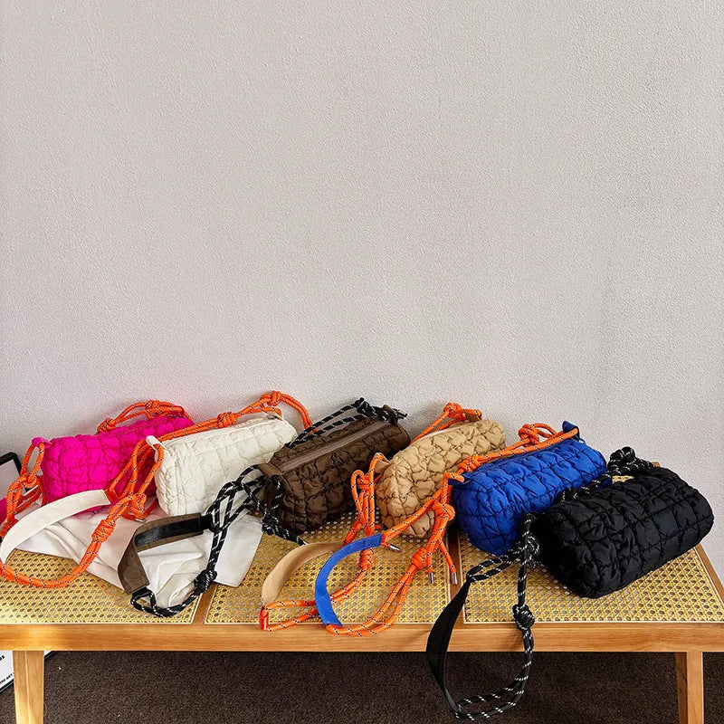 Women's lightweight nylon pillow-shaped messenger bag with rhombus pattern in chosen colour.