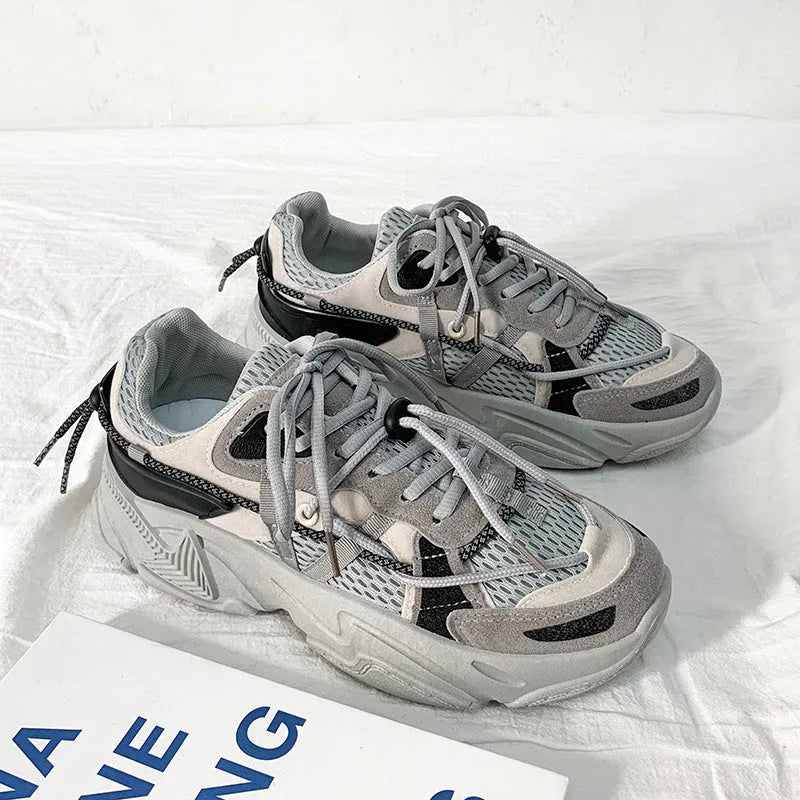 Men's white Korean-style platform sneakers with lace-up front on a plain background.