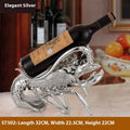 Lobster wine rack ornament in metallic finish displaying bottles
