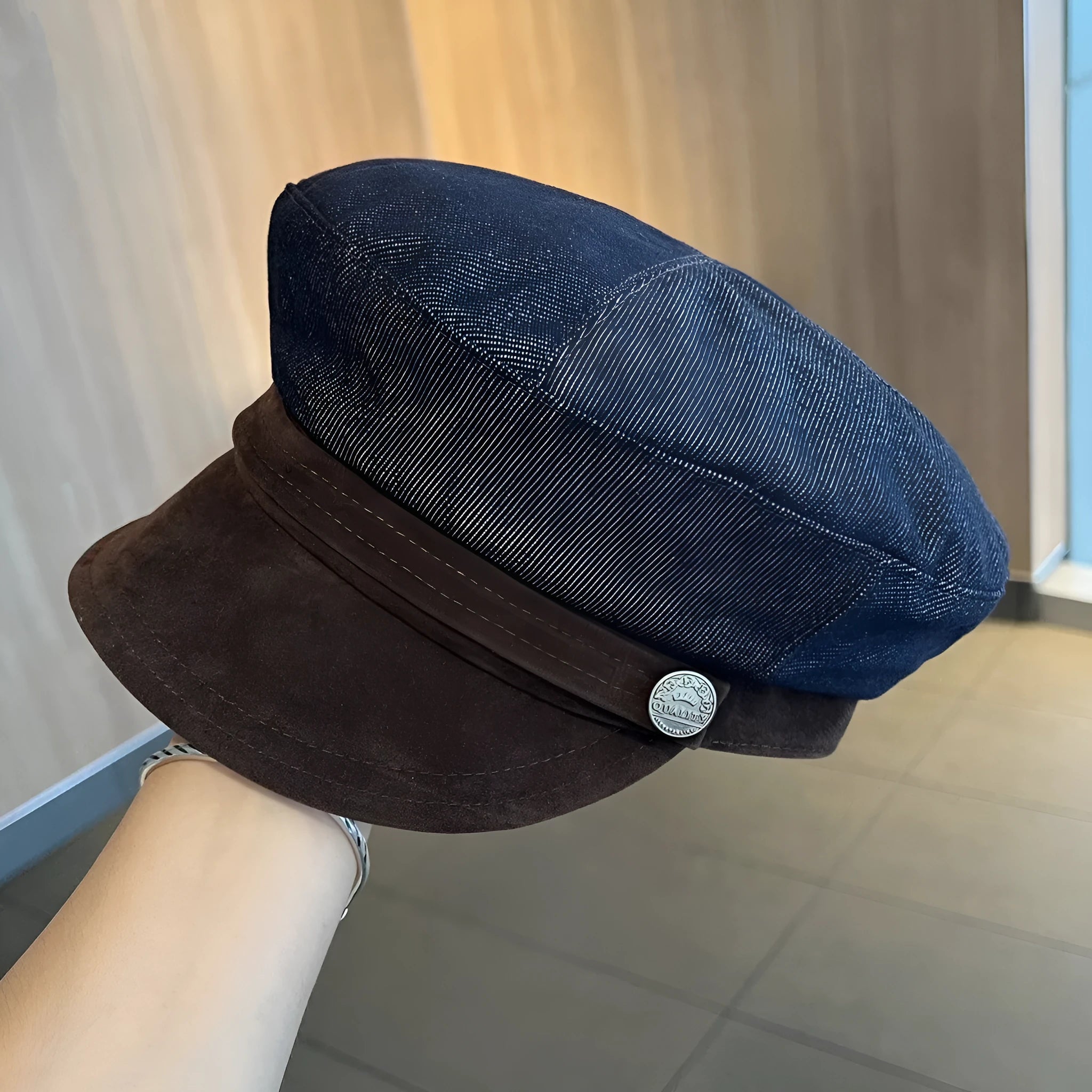 Dark blue denim newsboy hat with adjustable sizing and optional contrasting brim colours