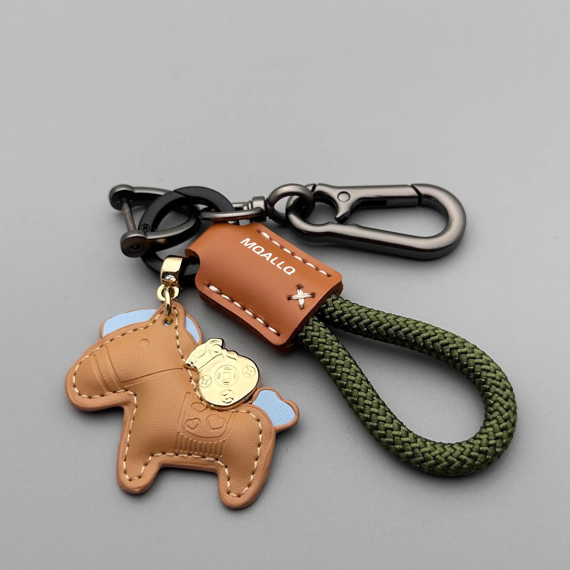 Handmade cowhide leather key ring pendant with zinc alloy pony buckle and coloured flanelle rope.