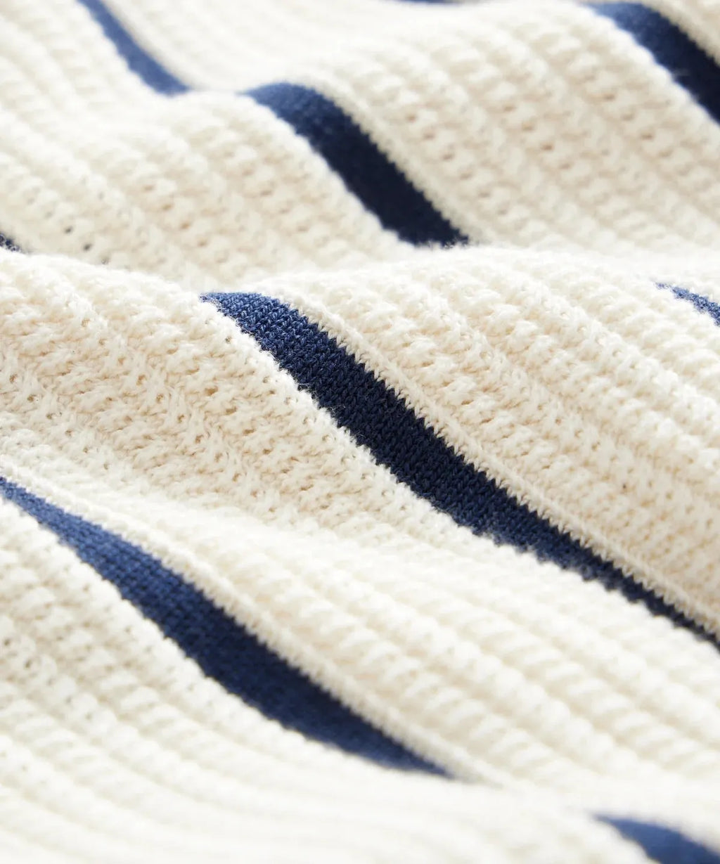 Men's white knitted short-sleeve shirt with lapel collar and asymmetrical British style design