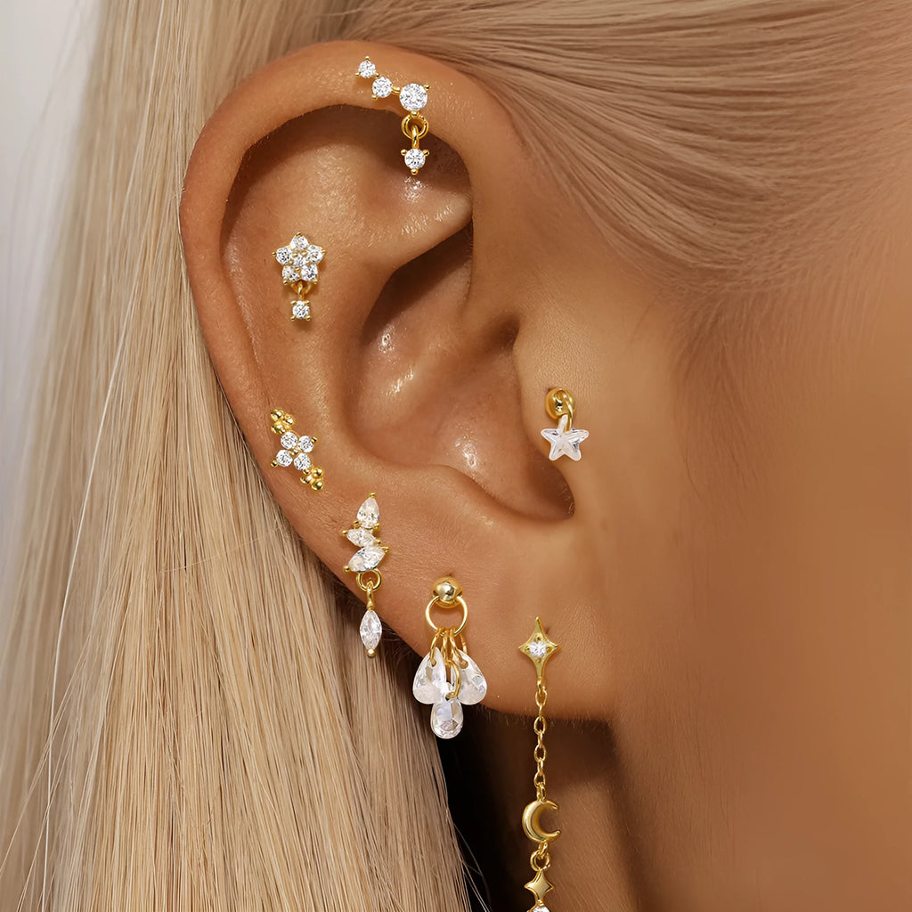 S925 sterling silver moon and star shaped earrings with embedded diamond details in a gold tone finish.