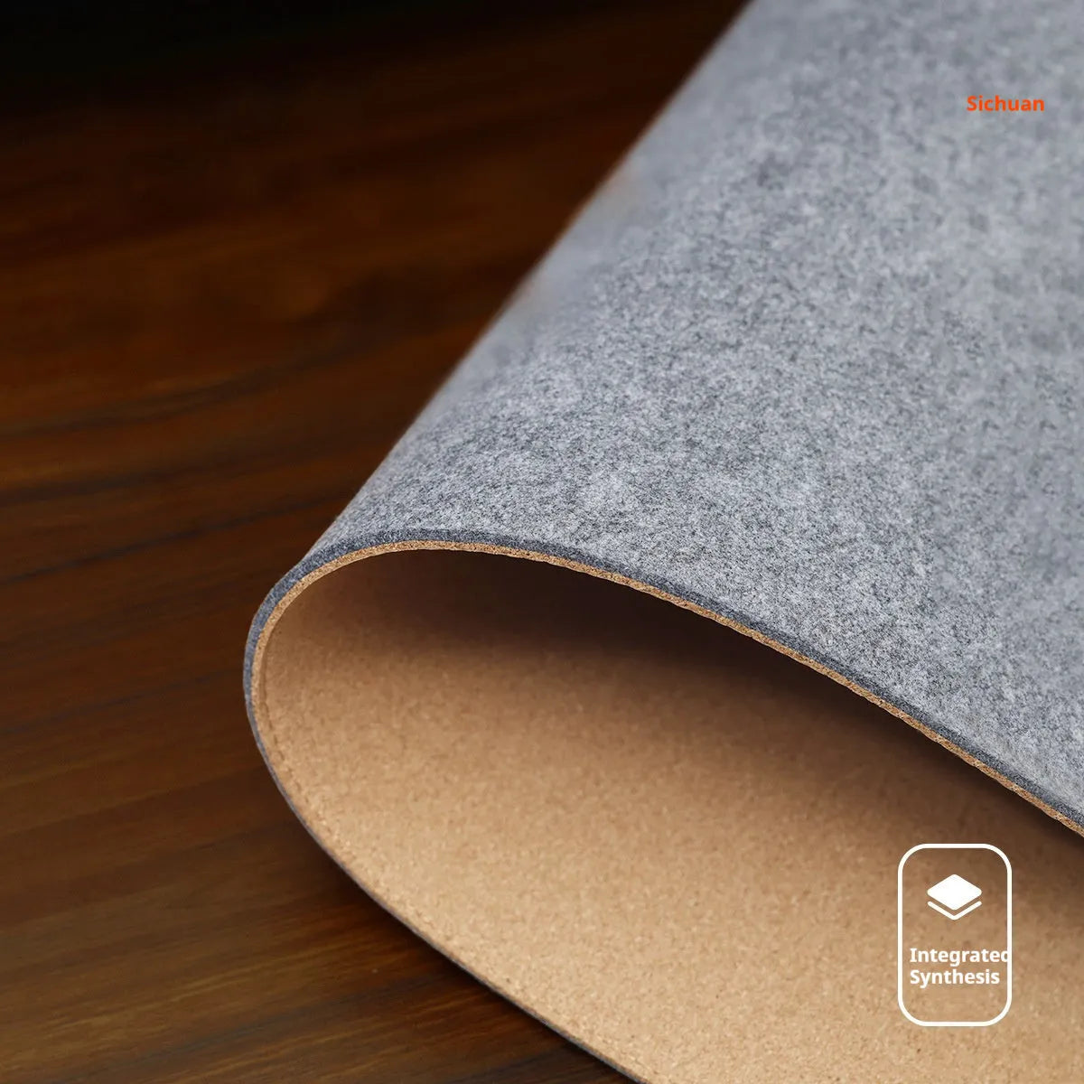 Medium grey felt cork oversized desk mat with Japanese style simple design on a wooden desk.