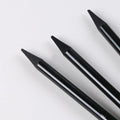 Graphite and carbonized pencil set showing six graphite pencils and three darker carbonized pencils on suction card packaging