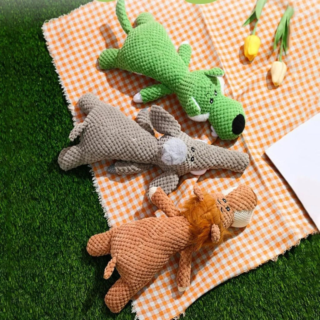 Plush dog chew toy with corn kernel texture and animal shape in green, grey, or yellow colours