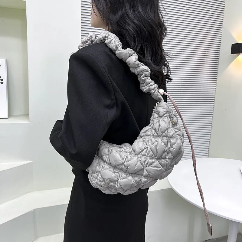 Women's light beige nylon messenger bag with long shoulder strap, shown with dimensions 35cm wide by 20cm high.