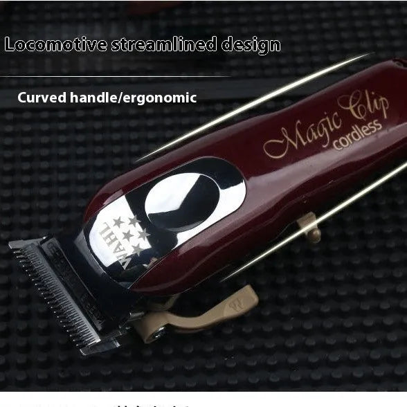 Charging hair clipper with stainless steel cutter head on a white background.