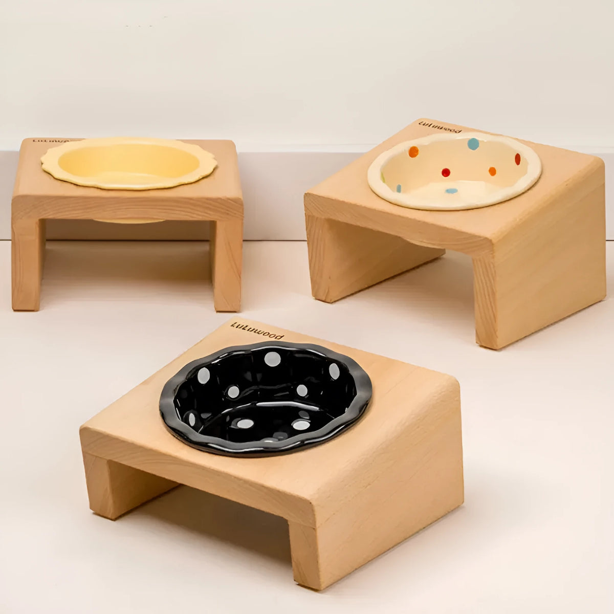 Beech heightened pet bowl rack with one ceramic polka dot bowl in beige, black, or colour option, shown as a raised feeding stand