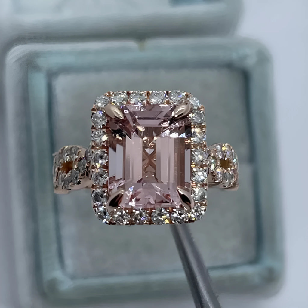 Geometric-shaped alloy ring with a rose gold electroplated finish on a neutral background.