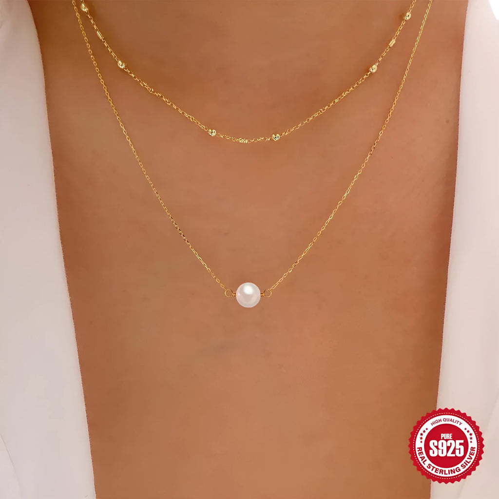 Sterling silver double layer necklace with twin pearls and geometric pendant in gold colour