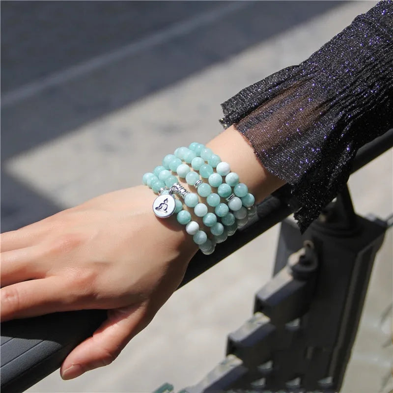 Natural stone ladies bracelet with geometric angel echeveria and lotus design on a wrist.