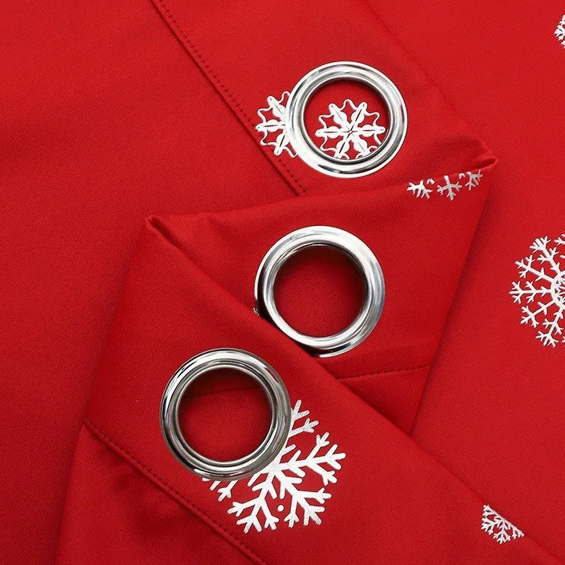 Red polyester snowflake pattern shade cloth curtain with lace loops hanging in modern interior setting