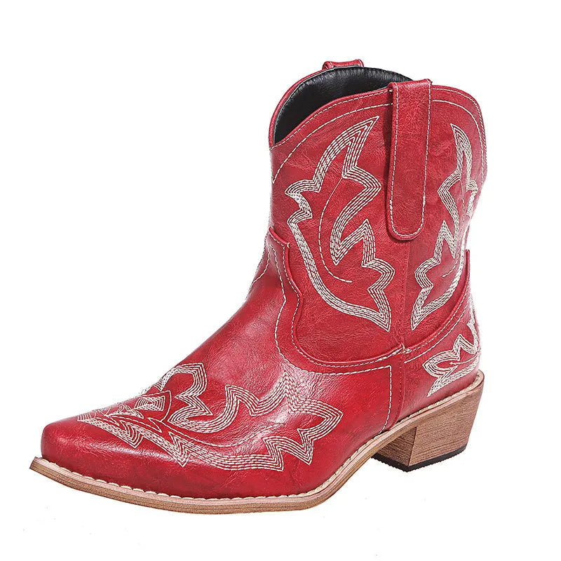 Women's blue cowboy boot with embroidery detail on the side, low wedge heel, and pointed toe.