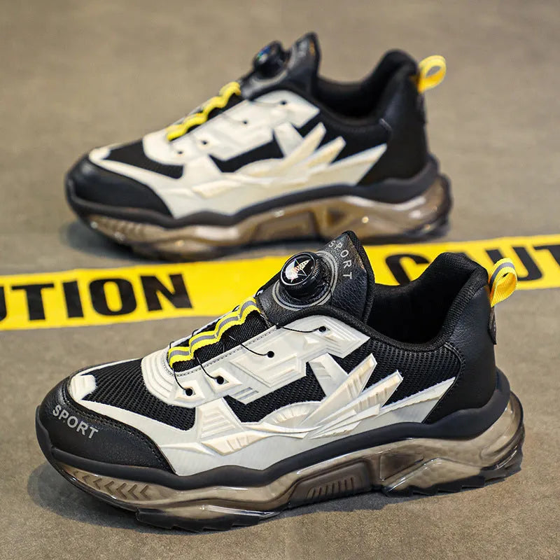 Men's black casual sneakers with rotating button closure and mesh upper on platform sole