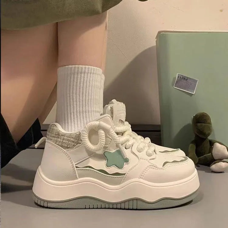 Women's green patent leather platform sneakers with lace-up front and rubber soles