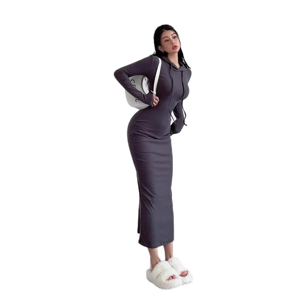 A woman's grey hooded long sleeve sheath dress with an over-the-knee length and high waist.