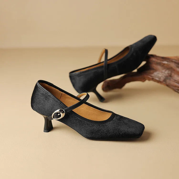 Women's black square toe stiletto heel ankle-strap shoes with a horse hair upper.