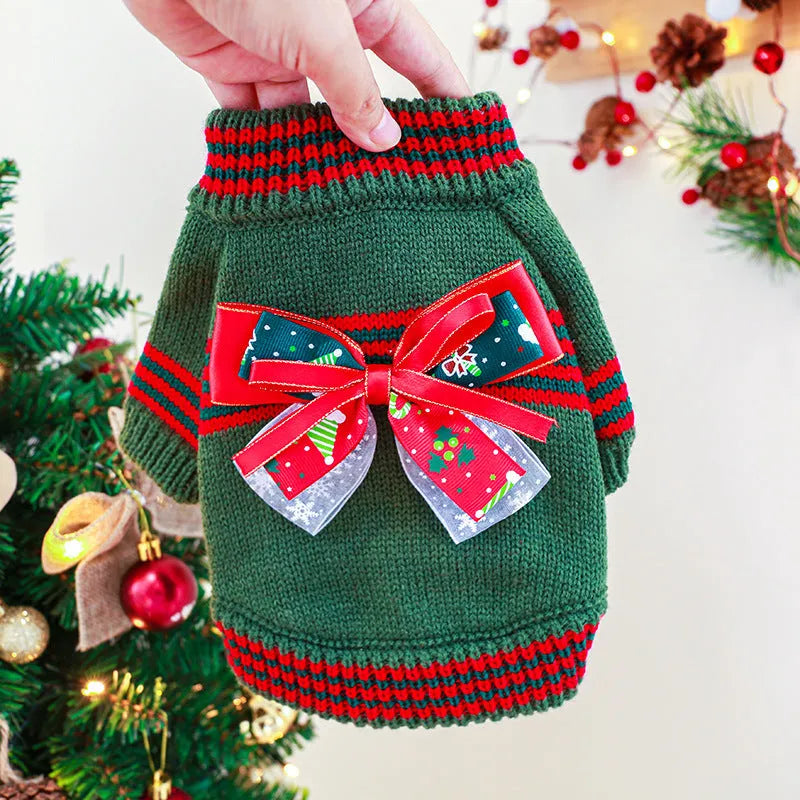 Red Christmas-themed dog jumper with festive pattern on small breed dog