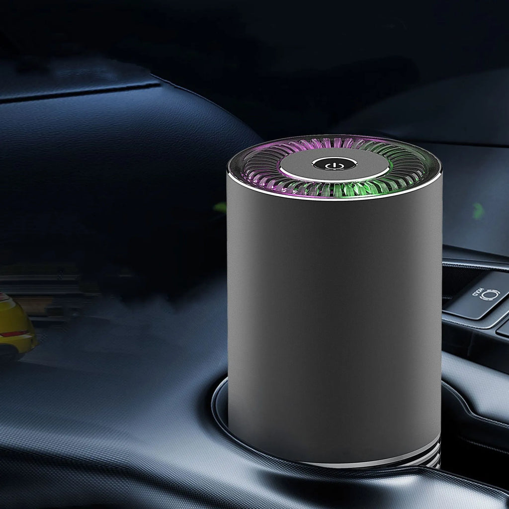 Compact cylindrical car air purifier in metallic grey showing 65mm diameter, with USB power cable.