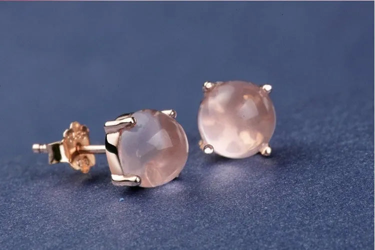 Rose gold drop-shaped stud earrings with synthetic ross quartz crystal inlay