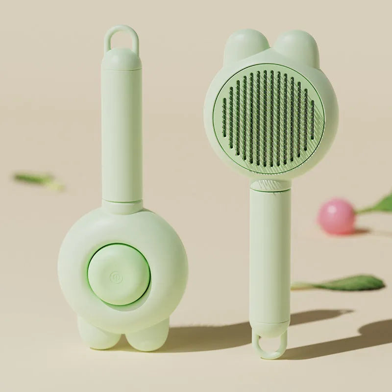 Green self-cleaning pet grooming brush with stainless steel comb and a release button on the handle.