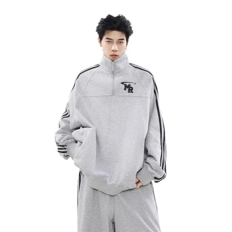 Black retro style polyester hooded sweater jacket with long sleeves on hanger