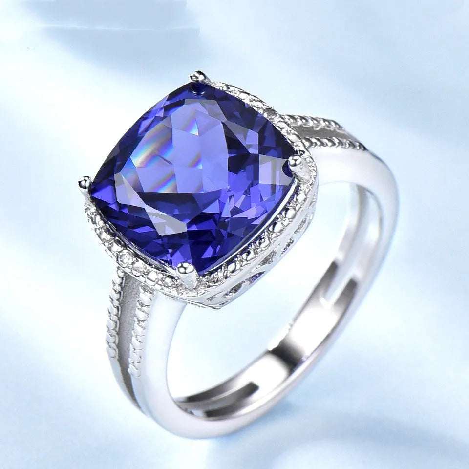 Women's sterling silver ring with blue Tanzanite gemstone, available in sizes 6 to 10