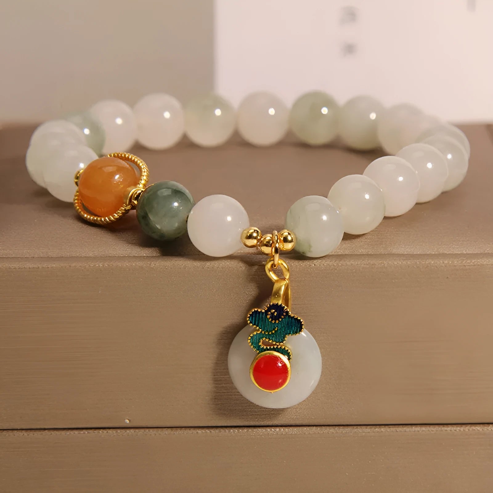 Women's ice jade bracelet with pearl accents and a jade buckle on a retro design.