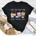 Black short sleeve cotton T-shirt with a round neckline on a hanger.