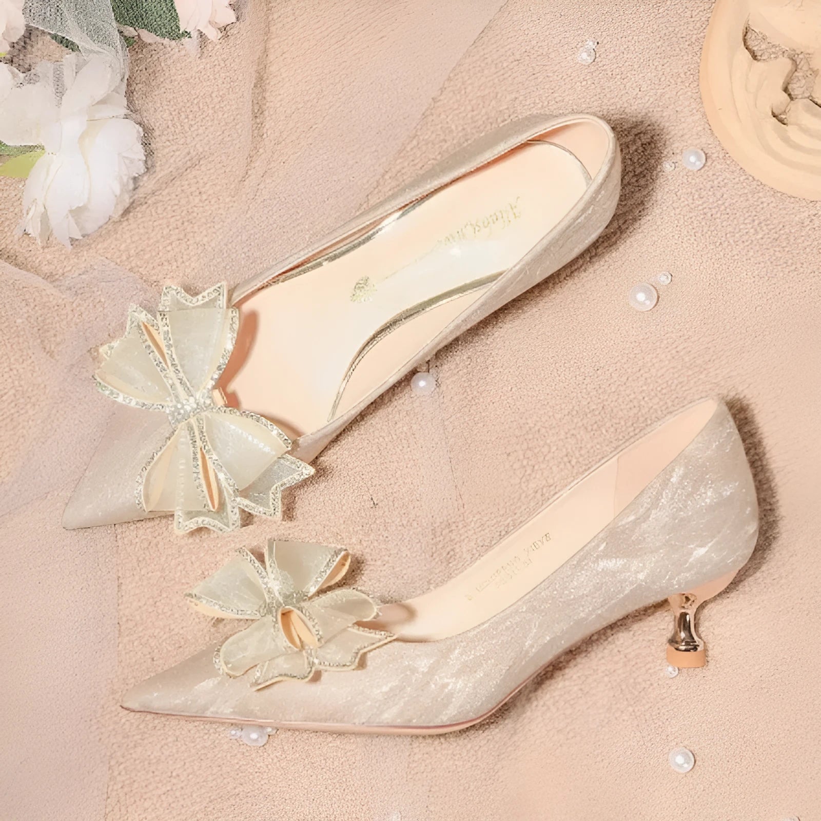 Champagne coloured women's stiletto pumps with sequin and crystal decoration on the upper