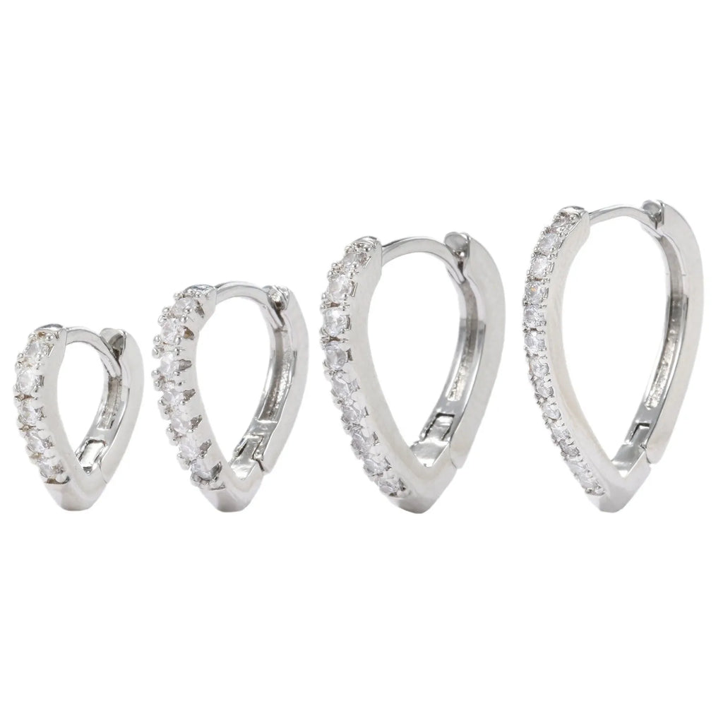 Geometric heart-shaped ear clip in gold and white colours with copper construction and electroplated finish