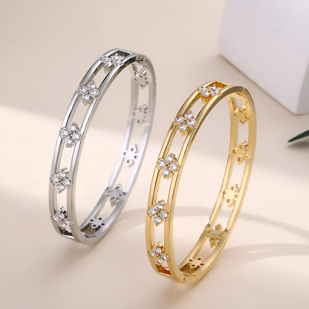 Gold and silver women's hollow bracelets with a four-leaf clover charm and zircon detailing.