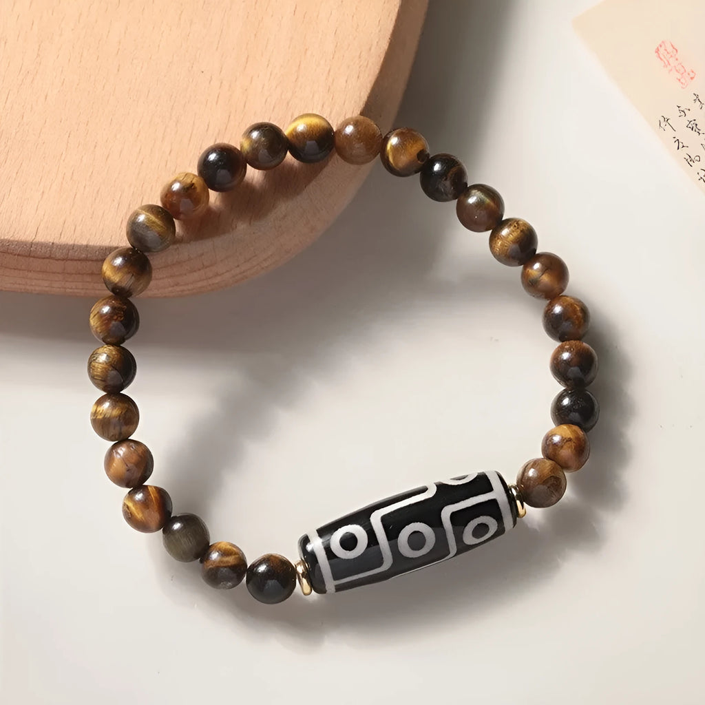 Simple Tigereye Dzi bead Buddha bracelet with single bead design on wrist
