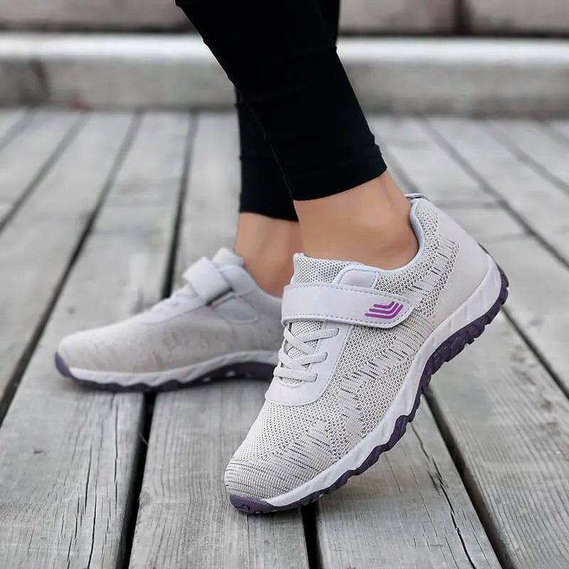 Women's grey purple wedge heel shoes with mesh upper and Velcro strap fastener.