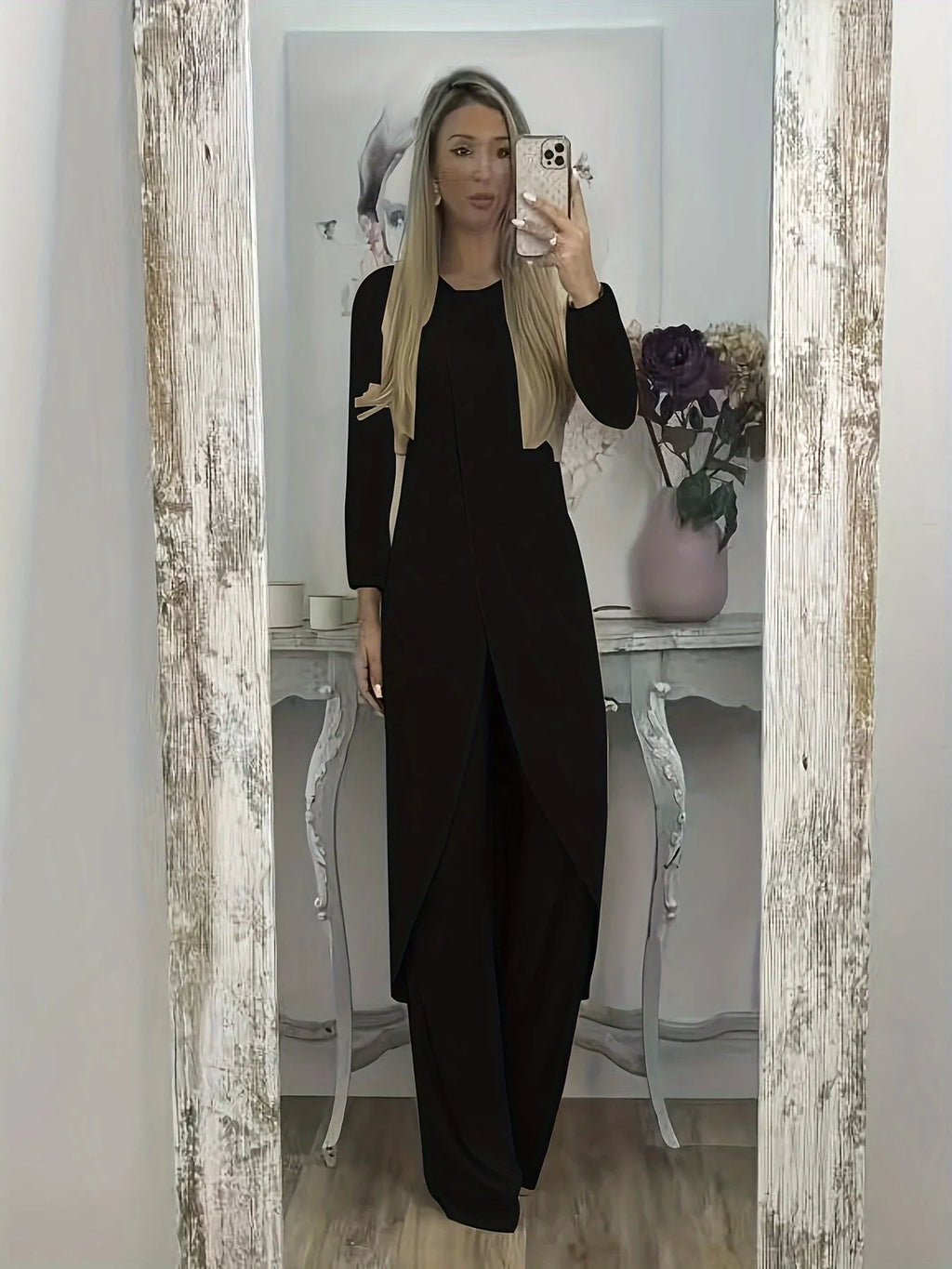 Women's black casual two-piece lounge set with long sleeves and matching trousers on a hanger
