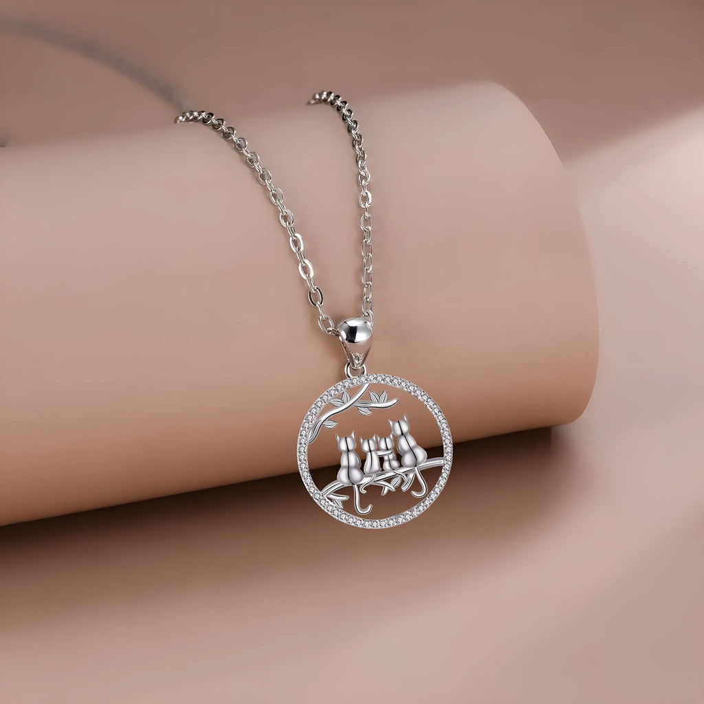 Women's four kitten necklace on copper cross chain with electroplated finish