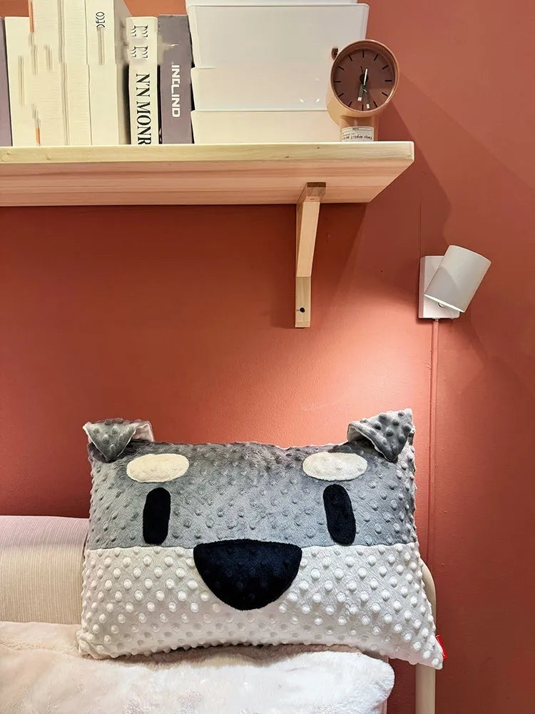 West Highland Terrier shaped decorative cushion pillow on a sofa.