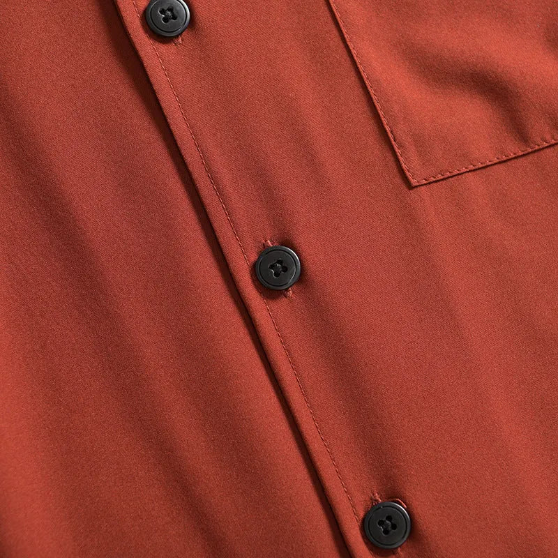 Man wearing a loose-fitting, solid colour short sleeve shirt in a Japanese fresh cardigan style.