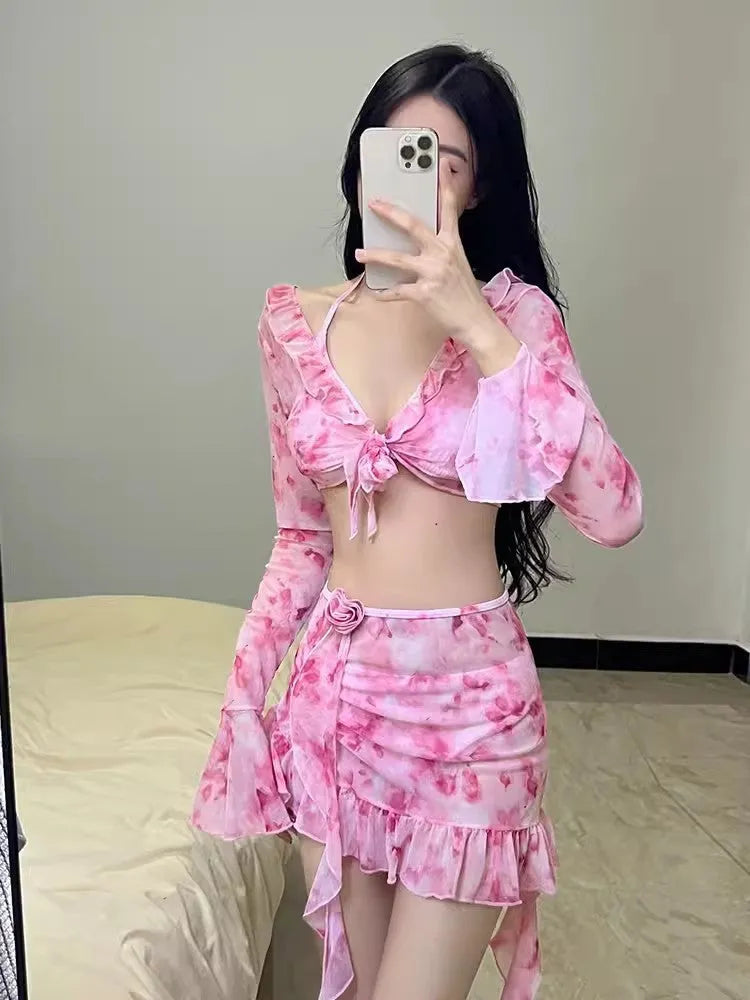 Cherry blossom pink women's floral bikini swimsuit laid flat